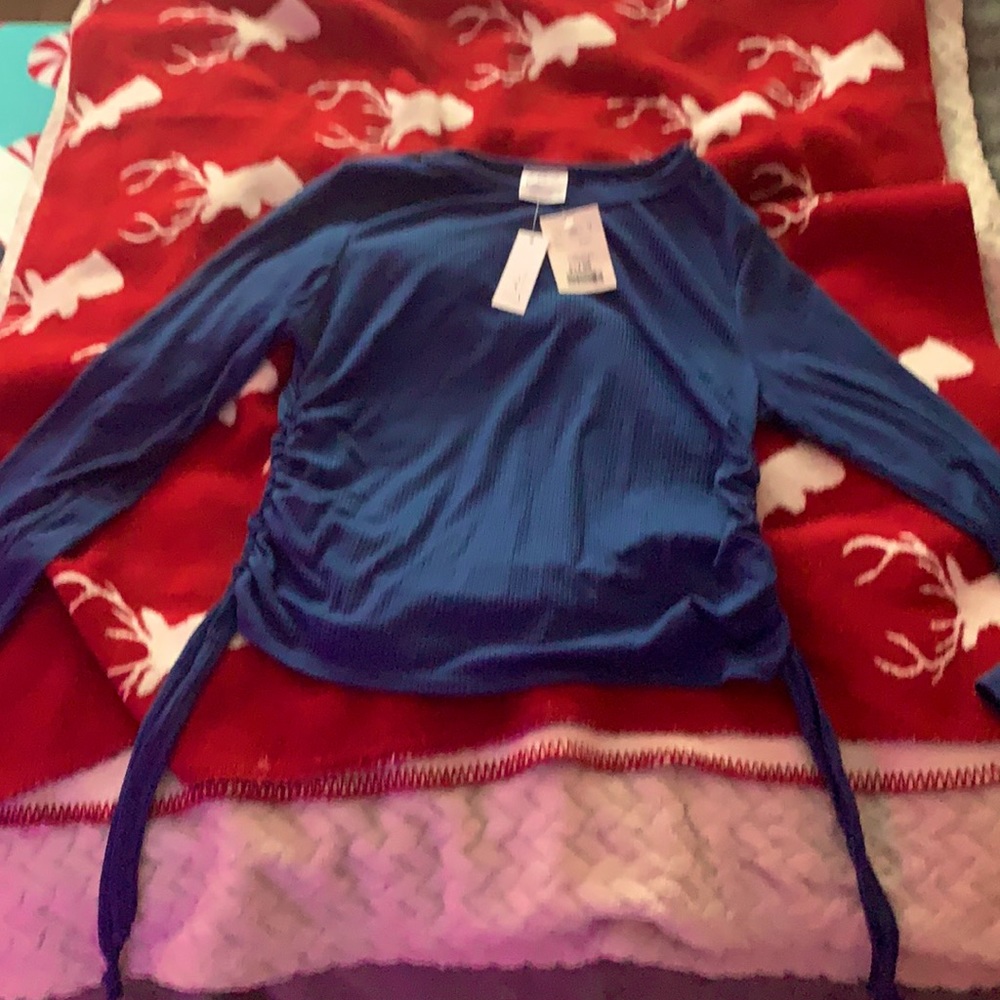 blue long sleeve tight fitting shirt, brand new still with tags on.